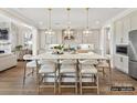 Spacious kitchen with quartz countertops, pendant lighting, stainless steel appliances and ample cabinet space at 6274 Chimney Bluff Rd, Lancaster, SC 29720