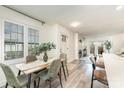 Sunlit dining room featuring an elegant table setting and views of a cozy fireplace at 1533 Briar Creek Rd # A, Charlotte, NC 28205