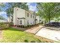 Exterior view of a home showcasing the well-maintained lawn and neat landscaping at 1533 Briar Creek Rd # A, Charlotte, NC 28205