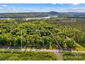 Beautiful aerial view of property and surrounding area featuring waterfront views and mature trees at 3755 River Rd, Richfield, NC 28137