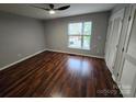 Bedroom featuring hardwood floors, a window, a ceiling fan and a closet for storage at 521 Donatello Ave, Charlotte, NC 28205