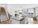 Modern kitchen featuring granite countertops, stainless steel appliances, and an island with seating at 5536 Pamplona Way, Charlotte, NC 28214