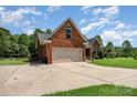 Beautiful brick home featuring an attached garage and a spacious driveway at 600 Old Hardin Rd, Dallas, NC 28034