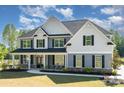 Charming two-story house with a welcoming front porch and meticulous landscaping, set in a serene neighborhood at 6814 Forney Hill Rd # 2, Denver, NC 28037
