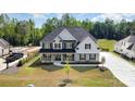 Attractive home with a well-manicured lawn, featuring a covered front porch and spacious driveway at 6814 Forney Hill Rd # 2, Denver, NC 28037