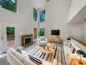 Bright, airy living room with high ceilings, fireplace, and stylish furnishings for a modern aesthetic at 9116 Torrence Creek Ct, Huntersville, NC 28078