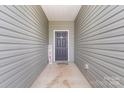 Inviting entryway featuring neutral tones and a welcoming front door, creating a warm and appealing first impression at 1109 Culver Spring Way, Charlotte, NC 28215