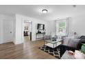 Inviting living room with modern furniture, stylish rug, and great natural light at 116 Barnes Ln, Stony Point, NC 28678