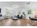 Spacious living room with stylish furniture and access to a home office area at 116 Barnes Ln, Stony Point, NC 28678