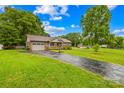 Single-story home with attached garage, inviting front porch, and a basketball hoop at 117 Ethel Ln, Statesville, NC 28625