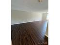 Bright and airy living room with sleek flooring and ample natural light at 118 Steam Engine Dr # 201, Mooresville, NC 28115
