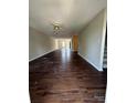 Spacious living room featuring hardwood floors and an open floor plan at 118 Steam Engine Dr # 201, Mooresville, NC 28115