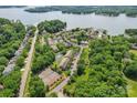 Breathtaking aerial view of community with lake, tennis courts, pool, clubhouse and green landscaping at 14118 Yachtsman Harbor Dr, Charlotte, NC 28278