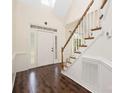Bright foyer featuring a staircase, hardwood floors, and a front door with sidelight windows at 1465 Porters Ct, Concord, NC 28025