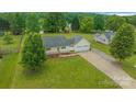 Inviting single-story home showcases a sprawling yard and convenient two-car garage at 195 Antler Dr, Statesville, NC 28625