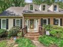 Inviting front entrance with brick steps and a decorative glass door at 2437 Woodleigh Dr, Gastonia, NC 28056