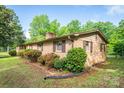 Brick home with manicured shrubs and an expansive lawn at 2871 Loviee Rd, Lincolnton, NC 28092