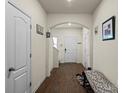 Inviting home foyer featuring hardwood floors and arched entryways at 2922 Patishall Ln, Charlotte, NC 28214