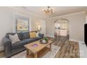 Inviting living room with hardwood floors and open view to the updated kitchen at 3141 Mathis Dr, Charlotte, NC 28208