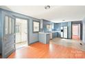 Open kitchen featuring updated appliances, plenty of cabinet space, and a dining area at 409 Rosemont Ave, Kannapolis, NC 28081