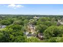 Aerial view of a property surrounded by lush trees, offering privacy and a serene environment at 522 Herms Ave, Mount Holly, NC 28120