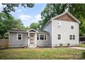 Charming home featuring a well-maintained lawn, gray siding, and a welcoming front entrance at 5421 Princess St, Charlotte, NC 28269