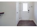 Inviting entryway featuring a stylish front door with glass paneling and dark wood floors at 5918 Barrowlands Ct, Charlotte, NC 28210