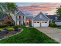 Charming two-story home with a manicured lawn, well-maintained landscaping, and a two-car garage at 7220 Swansea Ln, Cornelius, NC 28031