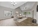 Bright living room featuring high ceilings, hardwood floors, and a neutral color palette at 8505 Loxton Cir, Charlotte, NC 28214