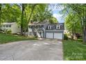 Charming two-story home with a well-manicured lawn and a two-car garage at 9238 Deer Spring Ln, Charlotte, NC 28210