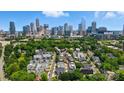 Urban neighborhood with lush trees and a stunning skyline view at 945 Westbrook Dr # A, Charlotte, NC 28202