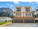 Modern townhome featuring a two-car garage and neutral color scheme at 945 Westbrook Dr # A, Charlotte, NC 28202