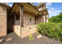 Inviting covered porch with brick columns and wrought iron railings at 1010 Nutall Oak Ln, Belmont, NC 28012