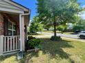 Close up of the front porch showing brick details and some landscaping at 11505 Sweetbriar Ridge Dr, Charlotte, NC 28269
