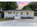 Charming single-story home featuring a freshly painted exterior, tidy landscaping and a newly updated driveway at 1218 E Woodlawn Rd, Charlotte, NC 28209