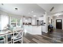 Bright open kitchen featuring white cabinets, modern appliances, and a breakfast bar at 126 Strand Rd, New London, NC 28127