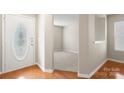 Bright entryway showcasing neutral walls and wood flooring at 14010 Pinyon Pine Ln, Charlotte, NC 28215