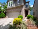 Charming two-story home with a brick facade, inviting front yard, and two-car garage at 14506 Knowledge Cir, Charlotte, NC 28277