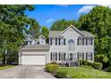 Charming two-story home with attached garage and well-maintained front yard at 146 Comata Rd, Mooresville, NC 28117