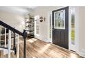 Inviting foyer features hardwood floors, decorative door, and natural light at 146 Comata Rd, Mooresville, NC 28117