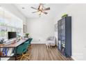 Bright and spacious office with a modern desk, chair, and decorative built-in shelving at 191 Tackle Box Dr, Troutman, NC 28166