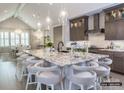 Beautiful kitchen with a large center island, modern lighting, and ample seating and cabinetry at 19329 Youngblood W Rd # 4, Charlotte, NC 28278
