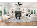 Bright living room boasts a fireplace, built-in shelving, and hardwood floors at 2224 Highland St, Charlotte, NC 28208