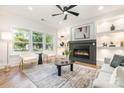 Elegant living room with fireplace, modern decor, and large windows at 2224 Highland St, Charlotte, NC 28208