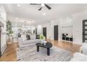 Spacious open-concept living room with modern decor, seamlessly flowing into the dining and kitchen areas at 2224 Highland St, Charlotte, NC 28208