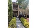 Charming two-story townhome with well-manicured landscaping and inviting covered entrance at 2279 Eversham Nw Dr, Concord, NC 28027