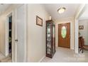 Inviting foyer with decorative door, neutral walls and patterned carpet at 2718 Ridgewood Ln, Rock Hill, SC 29730