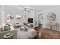 Bright living room with hardwood floors, neutral decor, and ample natural light at 370 Old Camden Rd, Lancaster, SC 29720