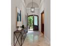 Bright foyer with a decorative table, tile flooring, and an arched doorway at 405 Gladelynn Way, Waxhaw, NC 28173