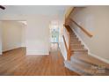 Open foyer with hardwood floors and staircase leading to the upper level at 4100 B Christine Ln, Waxhaw, NC 28173
